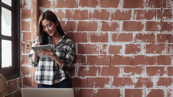 Casual woman planning with tablet