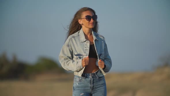 Girl in Jeans Clothes and Sunglasses