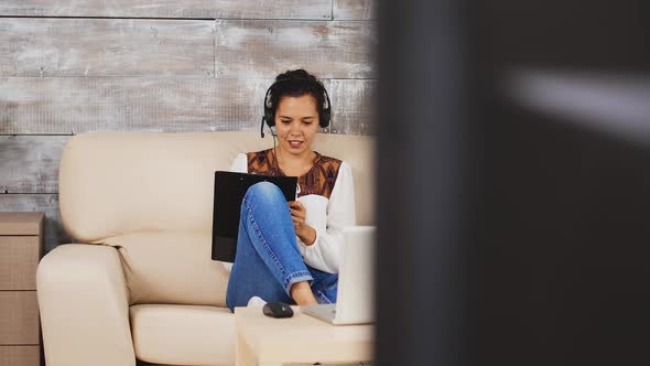 Woman Writing Notes on Clipboard