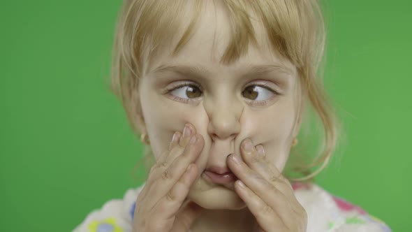 Pretty Little Child Making Crazy Face with Her Eyes. Portrait. Chroma Key