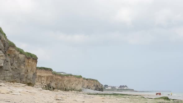 Sword beach allies landing area in WW2 northern France Normandy 4K 2160p 30 fps UltraHD tilting foot