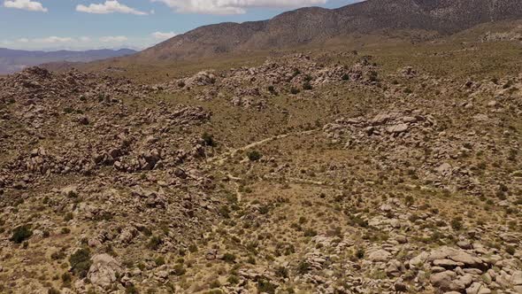 Aerial shot of interesting rock formations in the desert of California