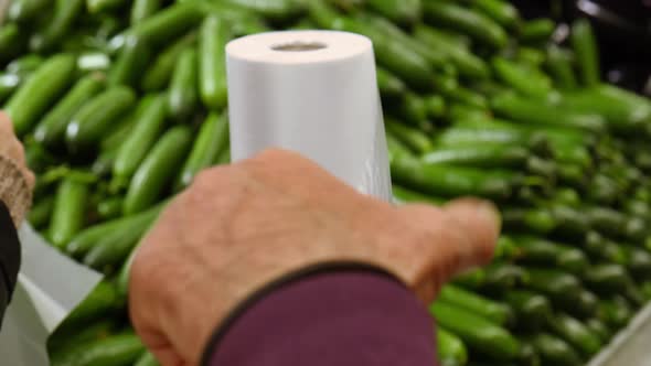 the Buyer Tear Off a Plastic Bag in a Supermarket