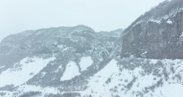 Aerial view of beautiful snowy mountains in Pasanauri, Georgia