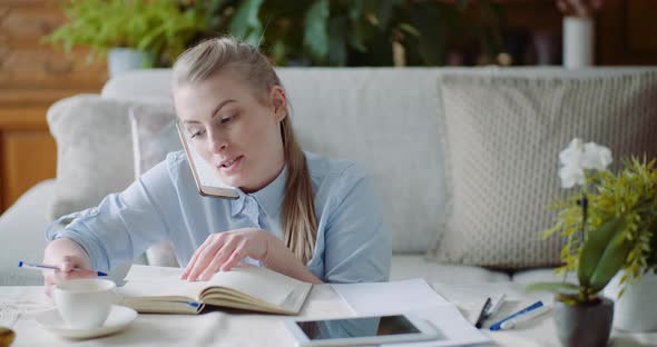 Woman Talking on Smartphone - Home Office