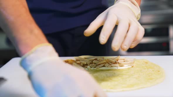 Chef cooking shawarma kebab. Chef preparing and making traditional shawarma