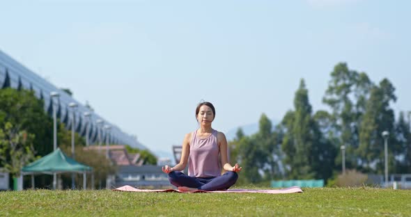 Woman do yoga at park