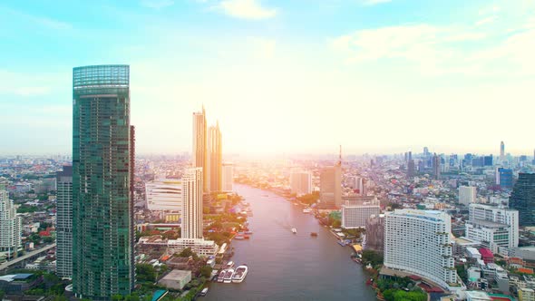 4K UHD : Aerial view over the Chao Phraya River and Buildings of Bangkok