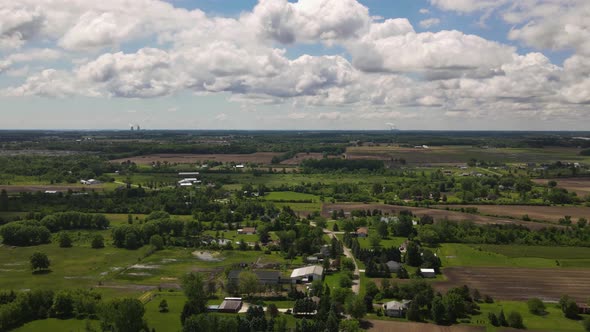 Hyper lapse, time lapse of Farms with clouds passing over head with a scenery landscape, Forwarding