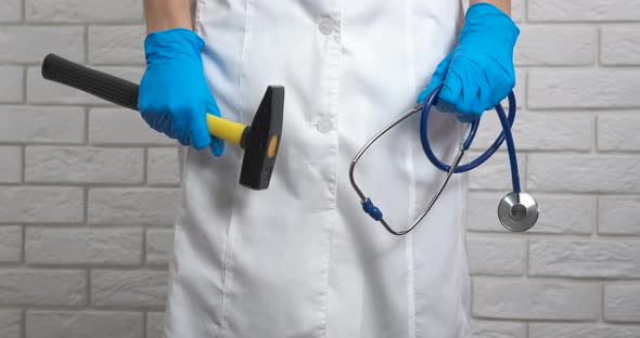 Medical worker with hammer.