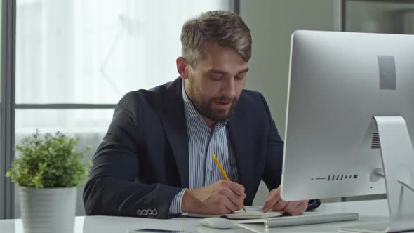 Businessman Having Visual Call on Computer