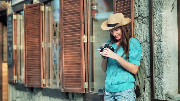 Backpacker Woman Taking Picture of Amazing Architecture and Cityscape Near European Style Window