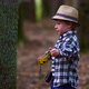 Young child measured with ruler trees in the forest. - VideoHive Item for Sale