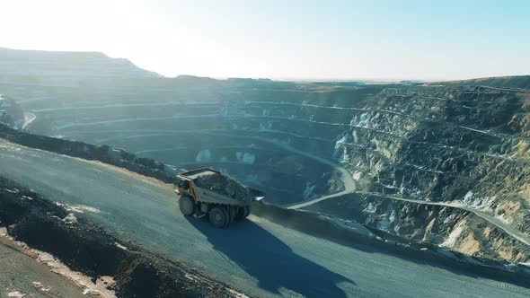 Loaded Truck is Riding Along the Copper Mine Deposit