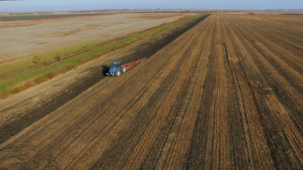 Agriculture - Tractor Plowing a Farm Field 2