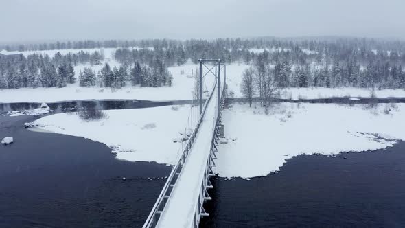 Aerial Nordic Winter Landscape Flight Over Snow Mountain Forest on Sunset