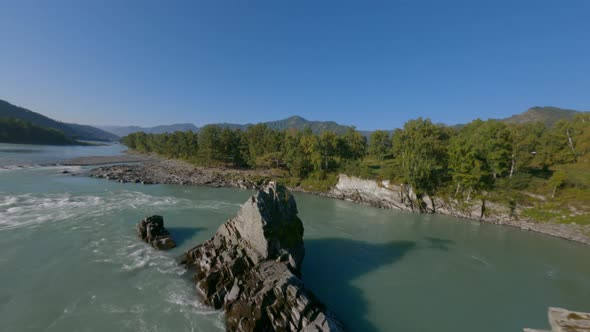 Aerial Rotation Shot Natural High Tree on Natural Cliff Stone Texture Fast Mountain River Flow