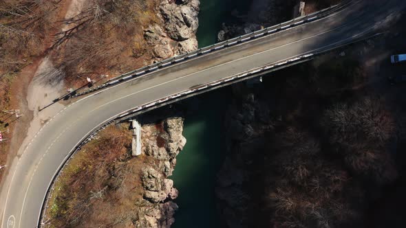 empty bridge and road top view, rocky coast