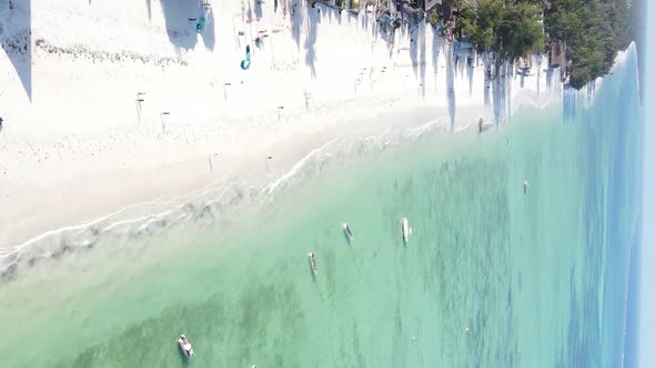 Vertical Video Boats in the Ocean Near the Coast of Zanzibar Tanzania Aerial View