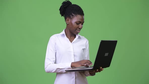 Young Beautiful African Businesswoman Using Laptop