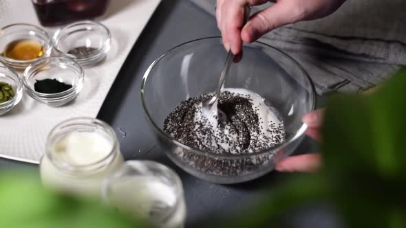 Adding chia seeds into natural yogurt