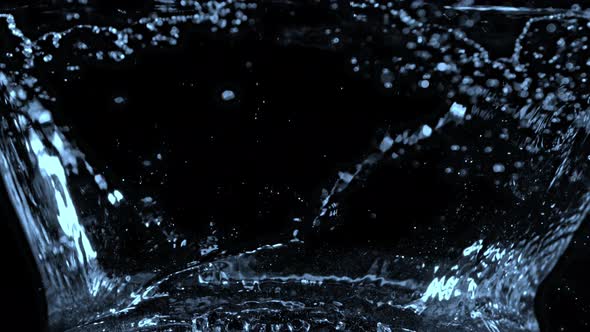 Super Slow Motion Shot of Water Splash at 1000Fps Isolated on Black Background.