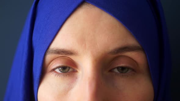 Portrait of a Muslim Woman on a Dark Background Close Up