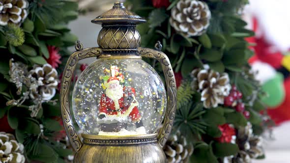 Snowglobe with Santa Clauss on Christmas background. Flat plane