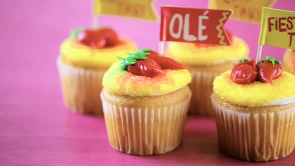 Cupcakes decorated with red chili peppers for Cinco de Mayo