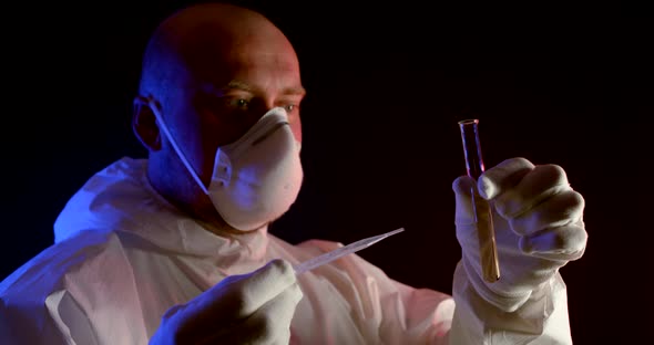 A Virologist in a Protective Suit Checks Water Samples for Reaction. Emergency Response