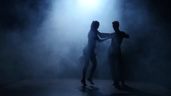 Dance Element From the Latina, Silhouette Couple Ballroom. Smoke Background