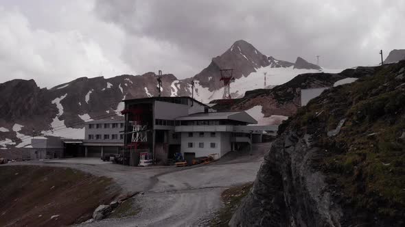 Cable Car Tower At The Kitzsteinhorn Mountain During Cloudy Weather In Kaprun, Austria. aerial