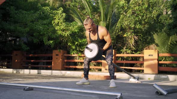 Athletic Man Working Out at an Outdoor Gym. Strength and Motivation.