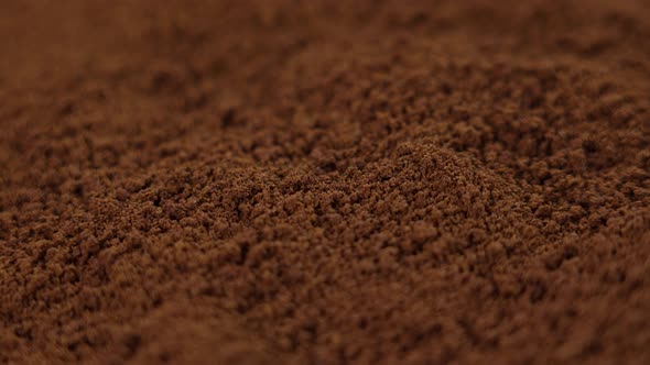 Instant coffee powder close-up. Brown morning fragrant drink granules