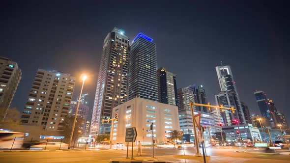 The Streets of the Night City with Road Traffic and Skyscrapers of Dubai