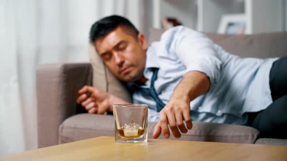 Alcoholic Lying on Sofa and Drinking Whiskey 9