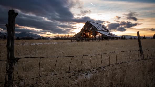 Time lapse of old barn at sunset