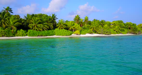 Wide angle aerial abstract view of a white sandy paradise beach and aqua turquoise water background 