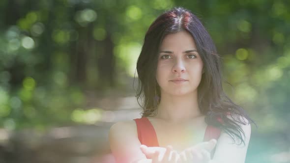 Beautiful Woman Shares Bright Light in Hands, Wisdom Concept, Religious Sign