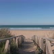Walking with steadicam on wooden footway on sand of Palmar Beach, Cadiz, Andalucia - VideoHive Item for Sale