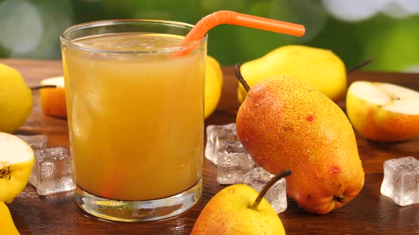 Pear Juice in Glass with Ripe Pears Around