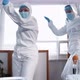 Two Happy Fun Female Scientists Doctors in White Medical Protection Suits Dance Celebrating Success - VideoHive Item for Sale