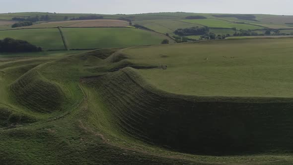 Aerial tracking around the eastern gate of the iron age hill fort, Maiden Castle. The maze-like ramp