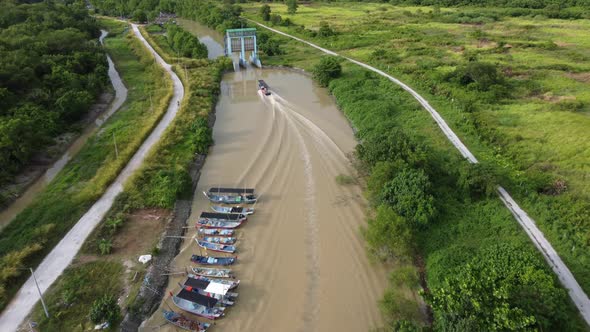 Aerial view fishing boat cross water pump gate