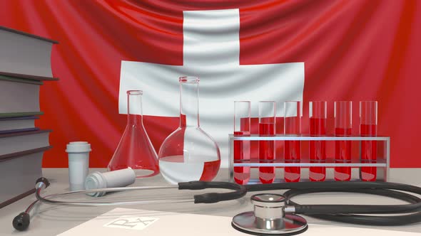Clinic Laboratory Equipment on Swiss Flag Background alt