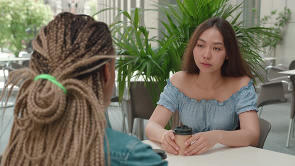 Female Friends Talking in Coffee Shop