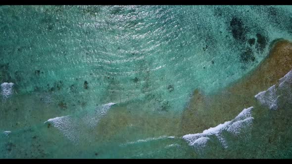 Aerial scenery of perfect bay beach trip by aqua blue water and white sandy background of a dayout n