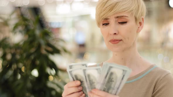 Headshot Caucasian Middle Aged Rich Woman Counting Money Checking Cash Salary Bonus Serious