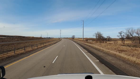 POV View From the Cab of a Truck Driving on a Highway