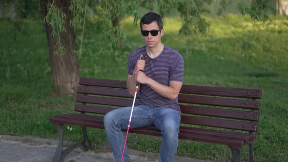 Blind Man Sitting on a Bench